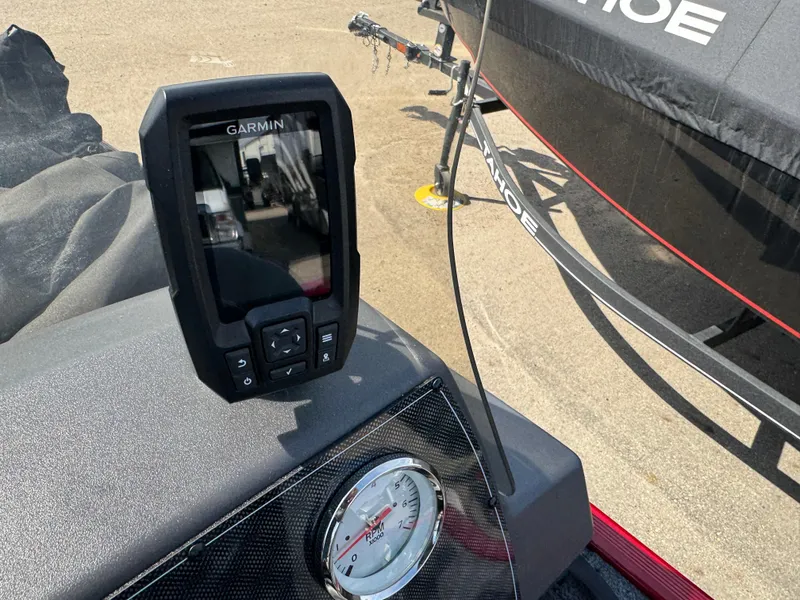 Slide: The Image of 2025 Tracker Bass Tracker Classic XL with Garmin device and gauge on dashboard. - 11