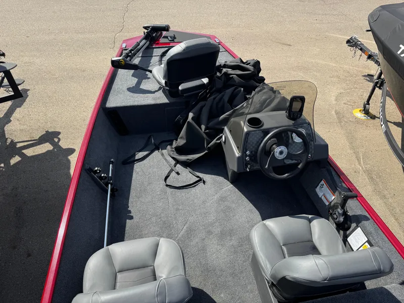 Slide: The Image of 2025 Tracker Bass Tracker Classic XL boat interior with steering wheel and seating. - 4