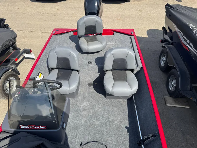 Slide: The Image of 2025 Tracker Bass Tracker Classic XL boat with gray seating and red accents. - 5