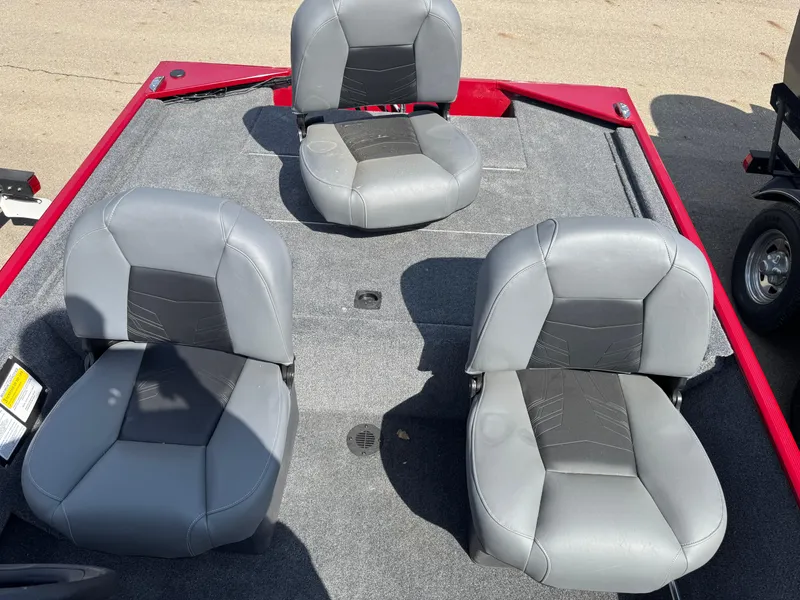 Slide: The Image of 2025 Tracker Bass Tracker Classic XL boat with gray seating on a red deck. - 9