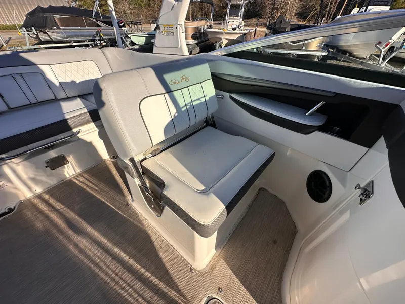 Slide: The Image of 2016 Sea Ray 240 Sundeck interior with cushioned seating and modern design. - 3