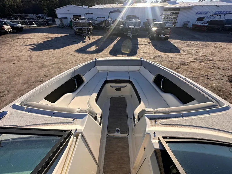 Slide: The Image of 2016 Sea Ray 240 Sundeck boat interior with spacious seating and sunlit deck. - 6