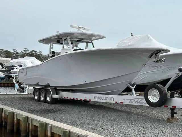 The Image of 2025 Tidewater 380 CC Adventure boat on trailer at marina. - 0