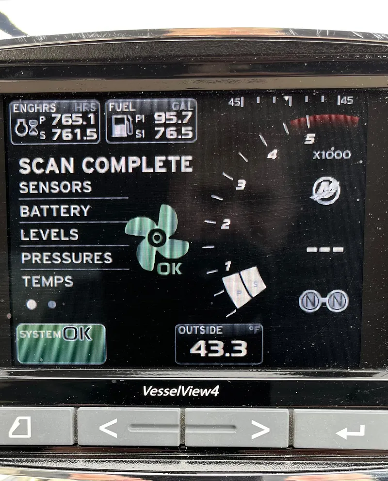 Slide: The Image of Dashboard display of a 2003 Sea Ray 380 Sundancer showing engine and system status. - 24