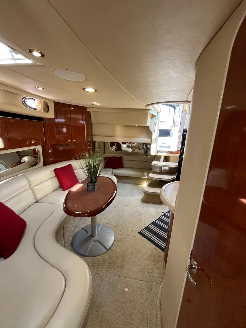 Slide: The Image of Luxurious interior of 2003 Sea Ray 380 Sundancer yacht with elegant seating and decor. - 25