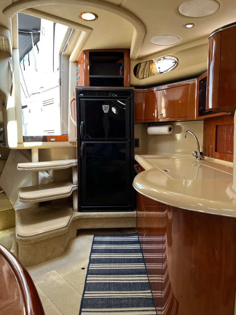 Slide: The Image of Interior of 2003 Sea Ray 380 Sundancer yacht with kitchenette and stairs. - 30