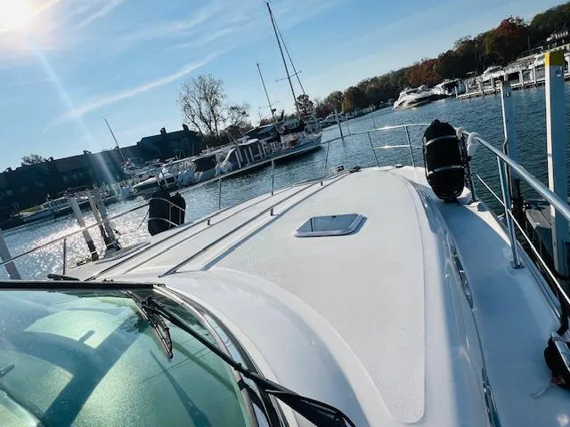 Slide: The Image of 2003 Sea Ray 380 Sundancer yacht docked in a sunny marina. - 4