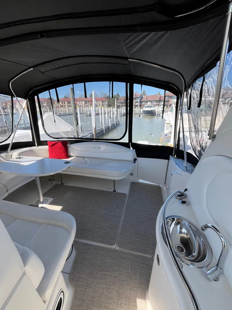 Slide: The Image of Interior of 2003 Sea Ray 380 Sundancer yacht with seating and marina view. - 9