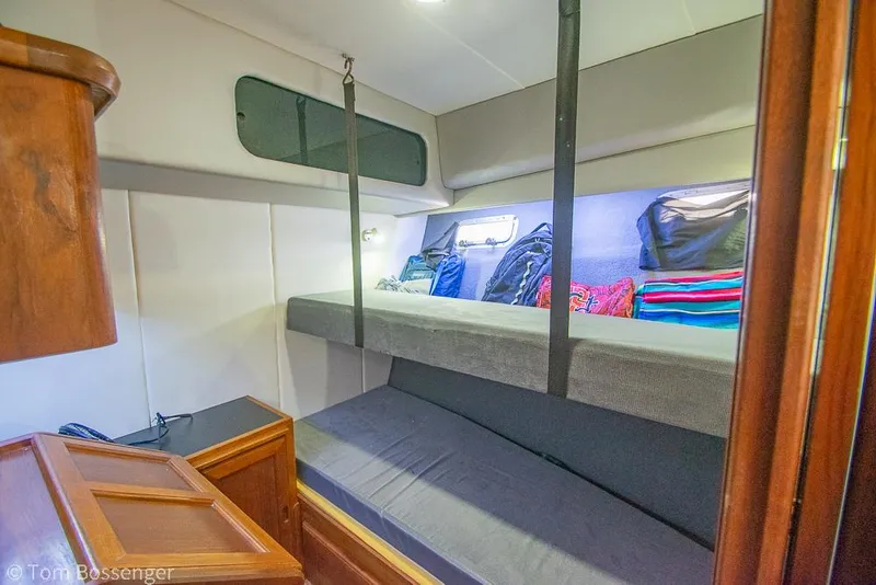Slide: The Image of Interior cabin of 1986 Bayliner 4588 Pilothouse with bunk beds and storage. - 26