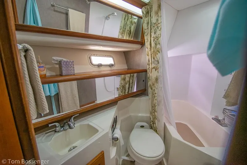 Slide: The Image of Bathroom interior of 1986 Bayliner 4588 Pilothouse with sink, toilet, and shower. - 27