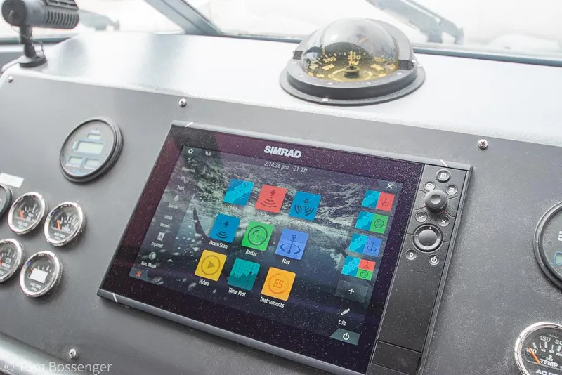 Slide: The Image of Pilothouse dashboard of 1986 Bayliner 4588 with Simrad navigation system and compass. - 35