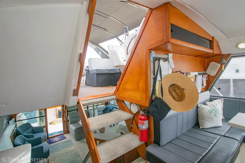 Slide: The Image of Interior of 1986 Bayliner 4588 Pilothouse with stairs, seating, and nautical decor. - 40