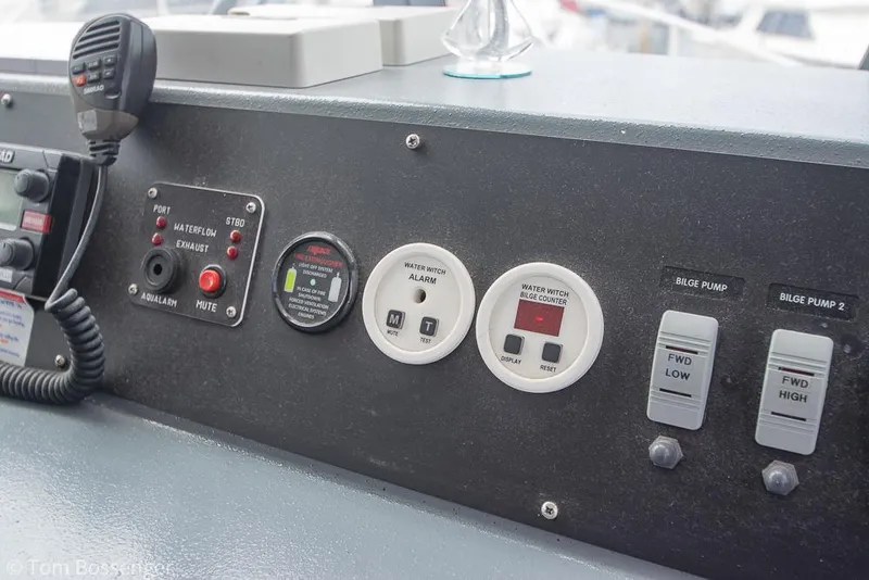 Slide: The Image of Control panel of 1986 Bayliner 4588 Pilothouse with switches and gauges. - 41