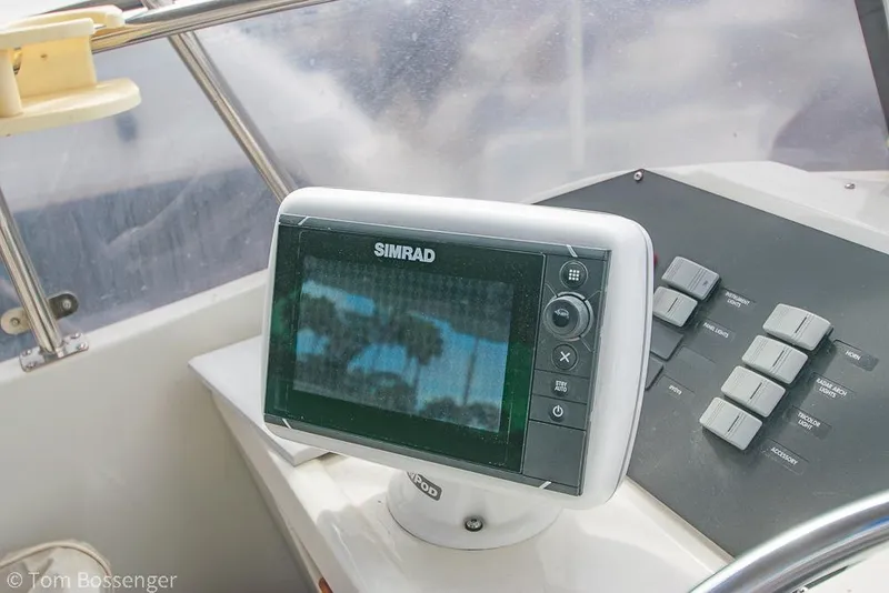 Slide: The Image of Simrad navigation system on 1986 Bayliner 4588 Pilothouse yacht dashboard. - 45