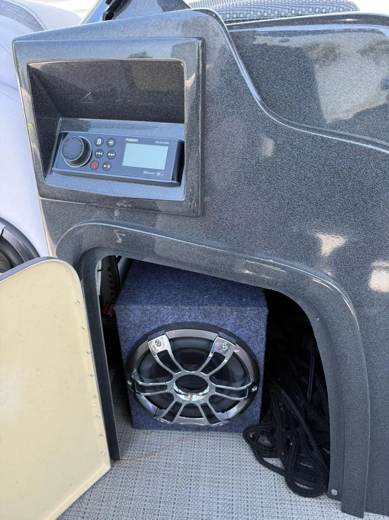 Slide: The Image of 2017 Crest Caliber 230 SLR2 boat audio system with speaker and control panel. - 13