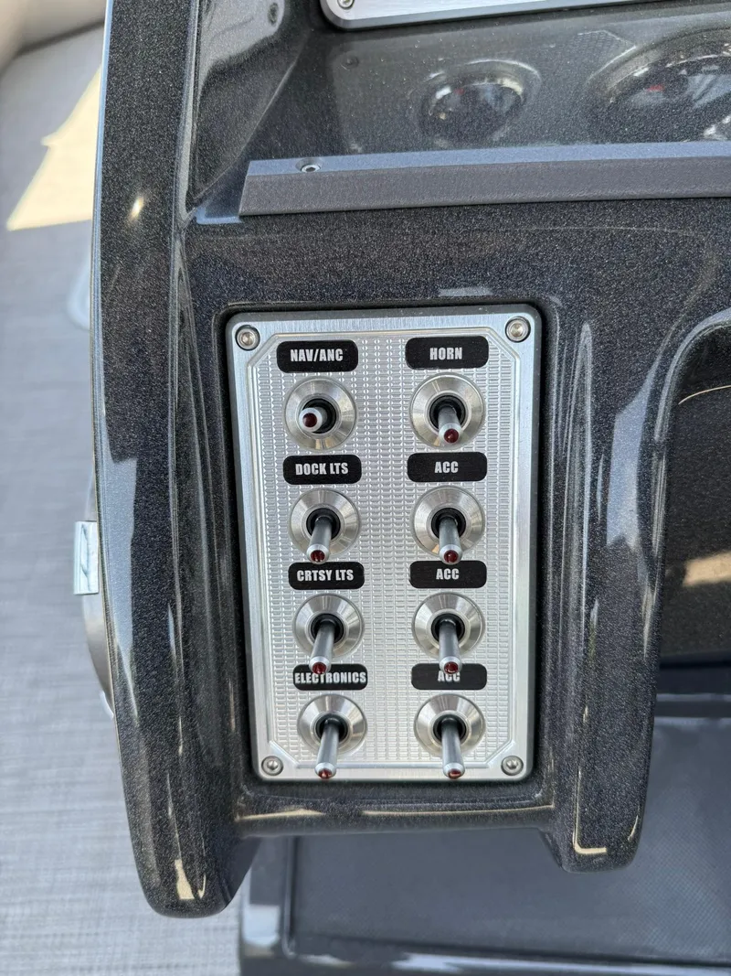 Slide: The Image of Control panel of 2017 Crest Caliber 230 SLR2 boat with labeled switches. - 14