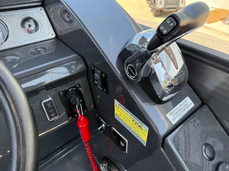 Slide: The Image of Control panel of a 2017 Crest Caliber 230 SLR2 boat with throttle and gauges. - 16