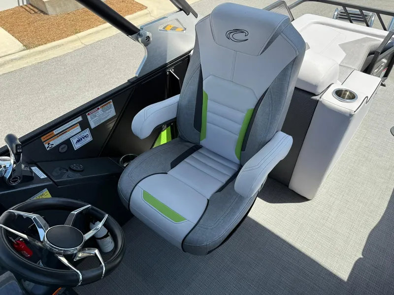 Slide: The Image of Captain's chair and steering wheel of 2017 Crest Caliber 230 SLR2 boat. - 18