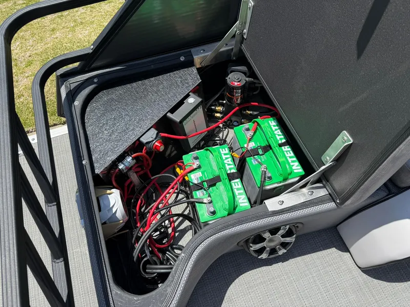 Slide: The Image of 2017 Crest Caliber 230 SLR2 boat battery compartment with Interstate batteries and wiring. - 21