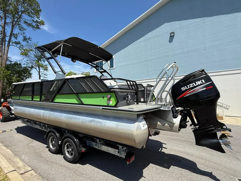 Slide: The Image of 2017 Crest Caliber 230 SLR2 pontoon boat with Suzuki outboard motor on trailer. - 4