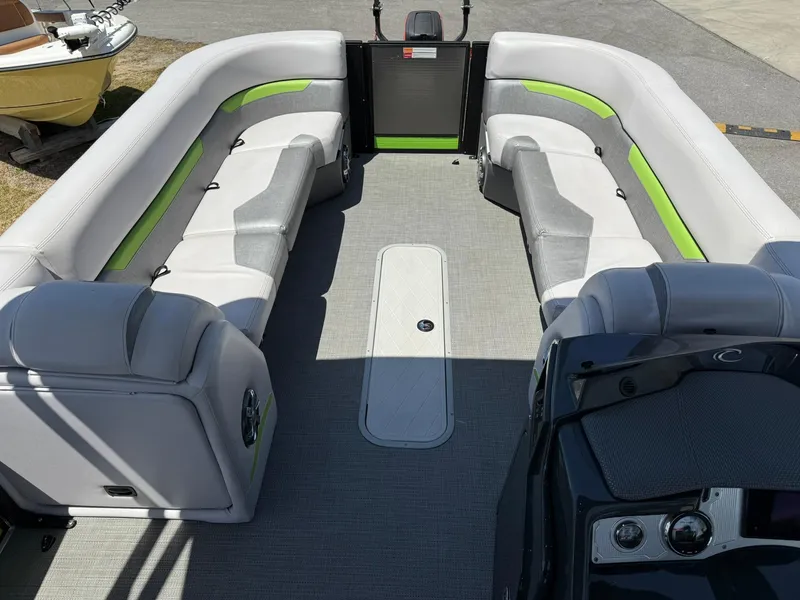 Slide: The Image of 2017 Crest Caliber 230 SLR2 pontoon boat interior with gray and green seating. - 5