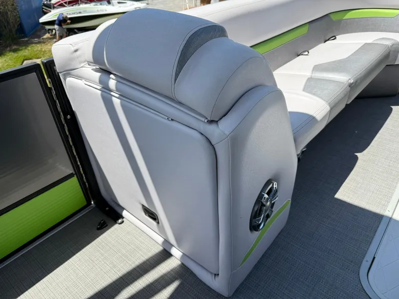 Slide: The Image of 2017 Crest Caliber 230 SLR2 boat interior with gray and green seating. - 6