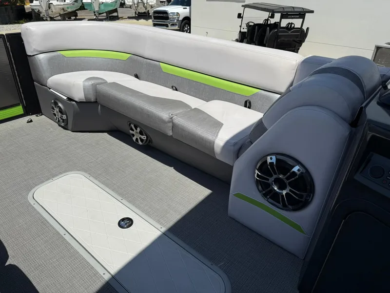 Slide: The Image of 2017 Crest Caliber 230 SLR2 boat interior with gray and green seating, speaker system. - 8