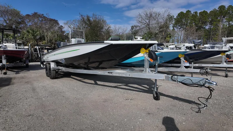 Slide: The Image of 2025 Xpress H24B boat on trailer in outdoor lot. - 3