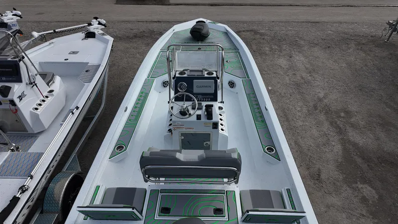 Slide: The Image of 2025 Xpress H24B boat with modern design and spacious deck layout. - 35