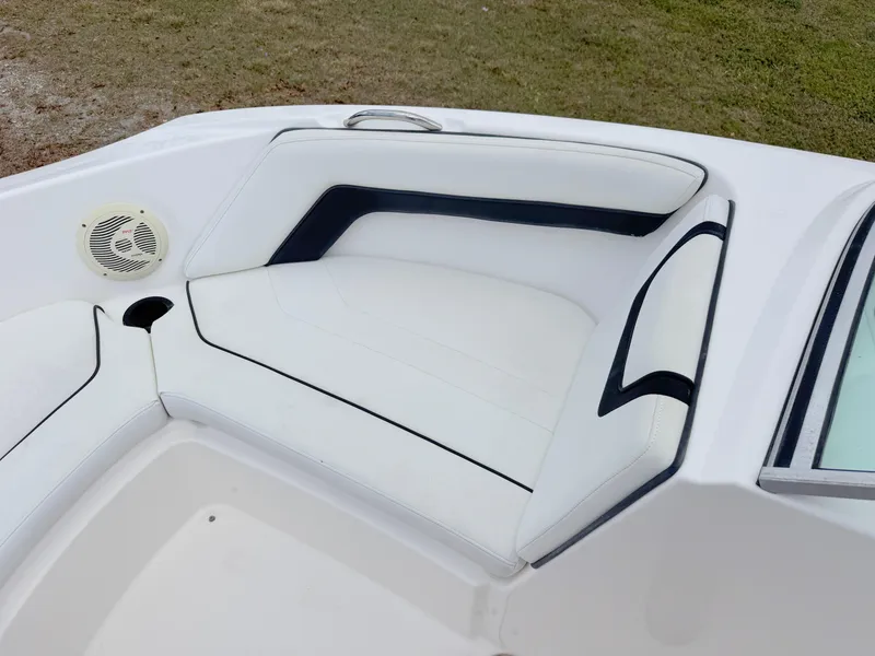 Slide: The Image of 2015 Yamaha Boats SX190 interior seating with white and black upholstery. - 11