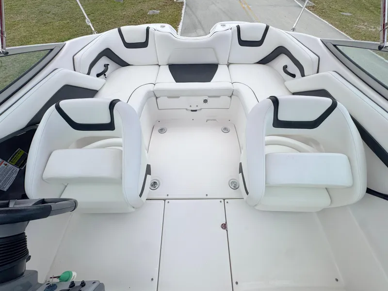 Slide: The Image of 2015 Yamaha Boats SX190 interior with white seating and modern design. - 12