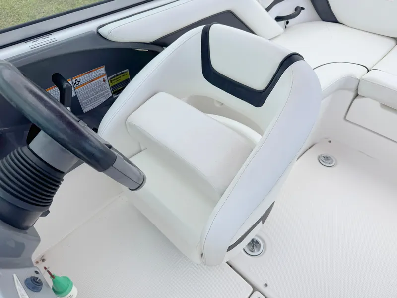 Slide: The Image of 2015 Yamaha Boats SX190 interior with white captain's seat and steering wheel. - 13