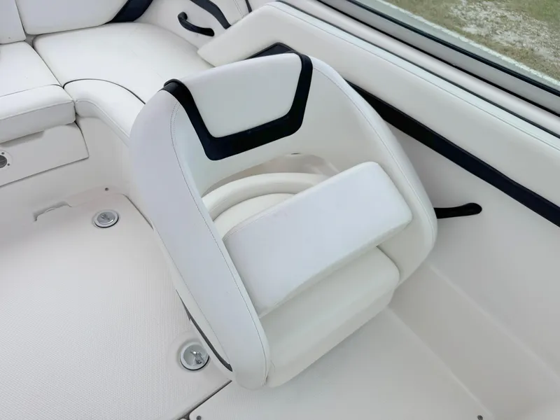 Slide: The Image of White interior seating of a 2015 Yamaha SX190 boat, featuring sleek design and comfortable upholstery. - 14