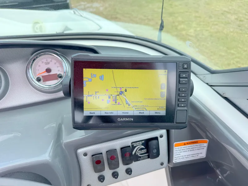 Slide: The Image of Dashboard of a 2015 Yamaha SX190 boat with Garmin GPS display. - 16