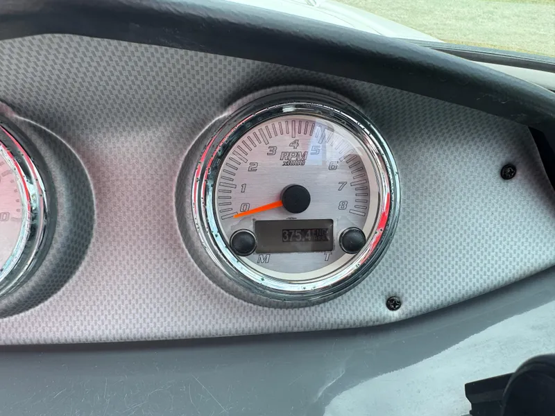 Slide: The Image of Dashboard of a 2015 Yamaha Boats SX190, featuring a speedometer and digital display. - 17