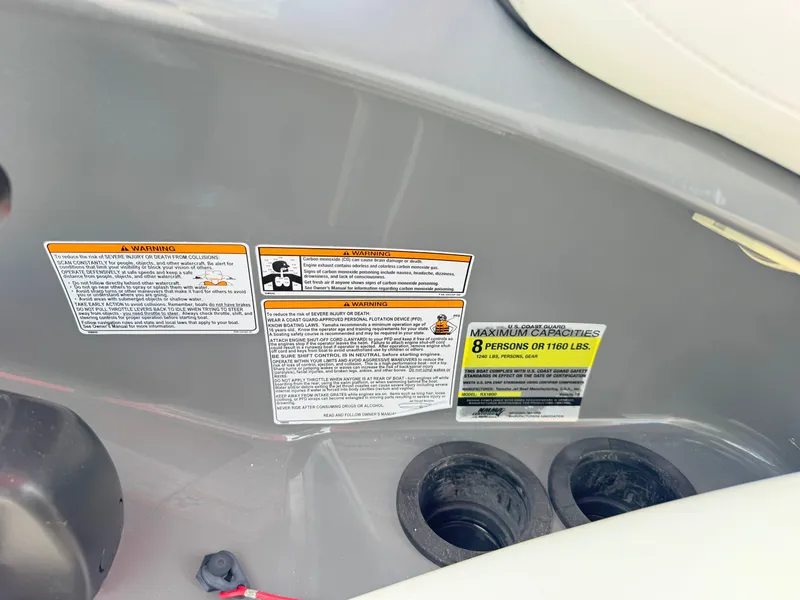 Slide: The Image of 2015 Yamaha SX190 boat warning labels and capacity information, showing seating for 8 people or 1100 lbs. - 18