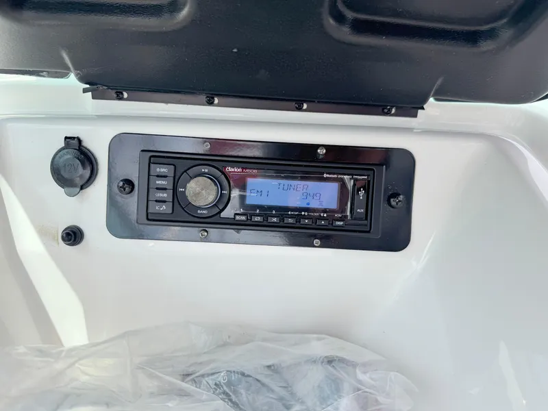 Slide: The Image of Dashboard of a 2015 Yamaha Boats SX190 featuring a Clarion marine stereo system. - 20
