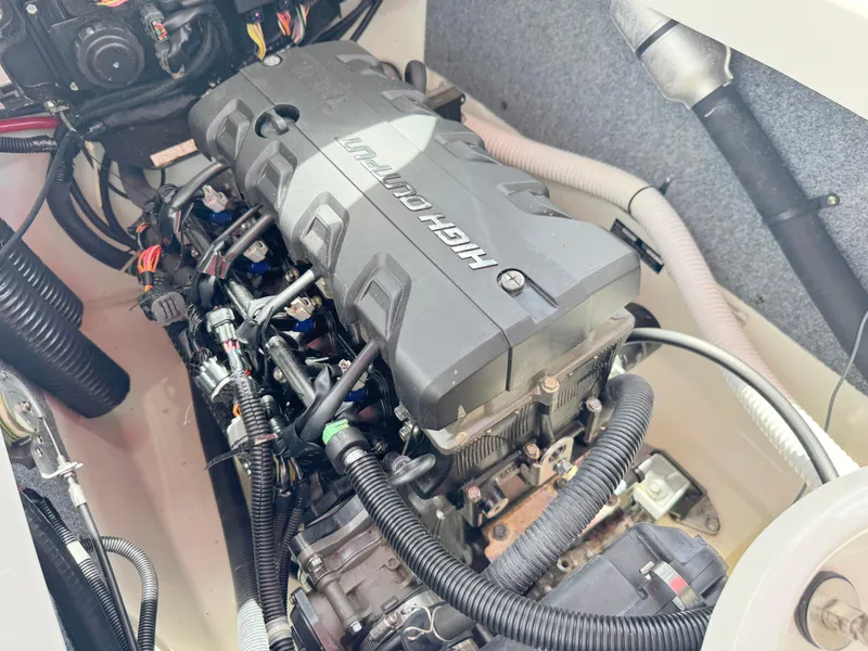 Slide: The Image of Engine compartment of a 2015 Yamaha Boats SX190, showcasing the high output engine. - 30