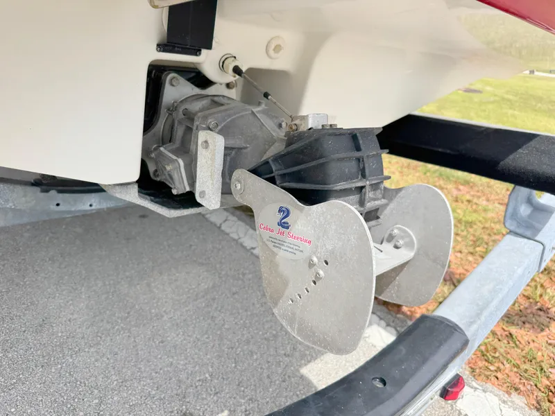 Slide: The Image of 2015 Yamaha SX190 boat battery compartment with wiring and charger. - 32