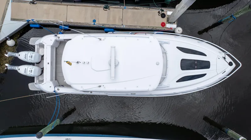 Slide: The Image of Top view of a 2022 Intrepid 345 Valor yacht docked at a marina. - 1