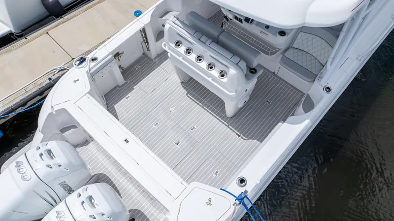 Slide: The Image of 2022 Intrepid 345 Valor boat deck with seating and dual engines. - 27