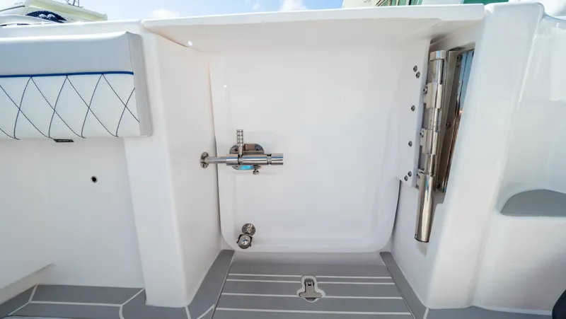 Slide: The Image of 2022 Intrepid 345 Valor boat interior with sleek white design and modern fixtures. - 35