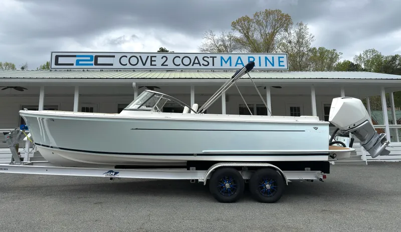 Slide: The Image of 2016 Vanquish 26 DC boat on trailer at Cove 2 Coast Marine dealership. - 1