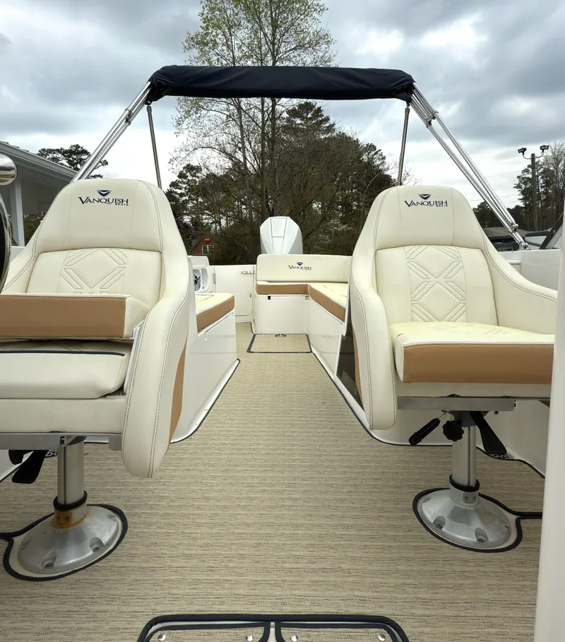 Slide: The Image of 2016 Vanquish 26 DC boat interior with plush seating and canopy. - 14