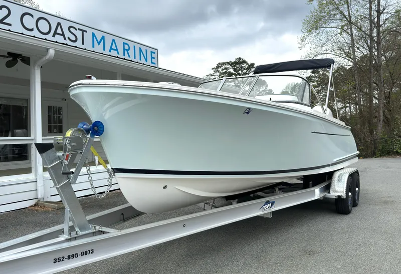 Slide: The Image of 2016 Vanquish 26 DC boat on trailer at Coast Marine dealership. - 19