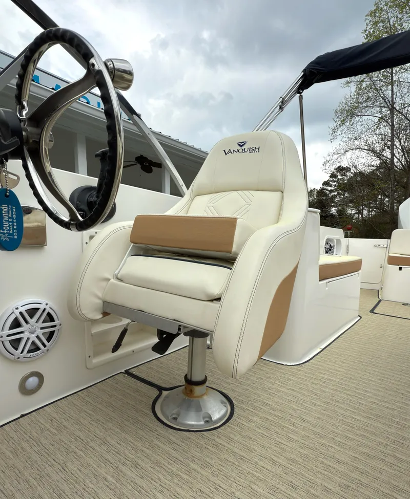 Slide: The Image of 2016 Vanquish 26 DC boat with spacious seating and elegant design. - 7