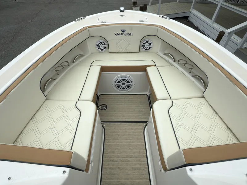 Slide: The Image of 2016 Vanquish 26 DC boat interior with branded speaker panel. - 9