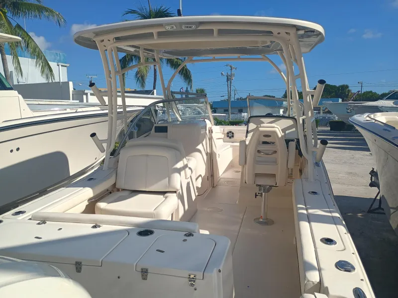 Slide: The Image of 2024 Grady-White Freedom 235 boat with spacious seating and modern design. - 12