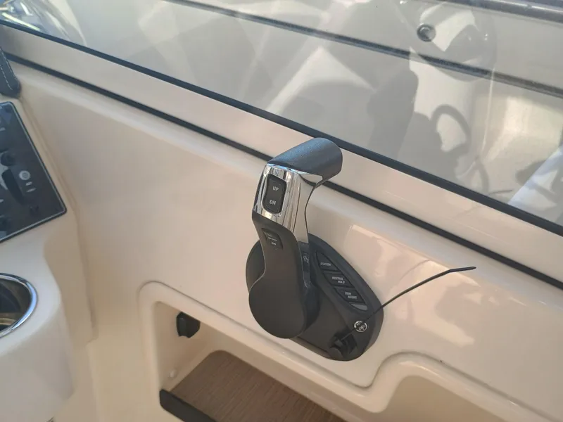 Slide: The Image of Throttle control of 2024 Grady-White Freedom 235 boat, featuring modern design and functionality. - 20