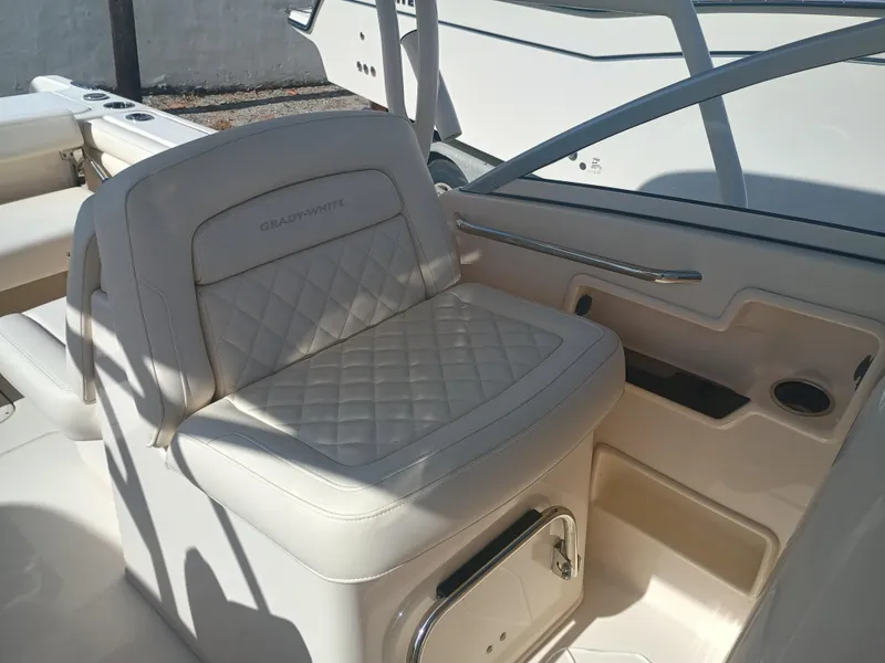 Slide: The Image of 2024 Grady-White Freedom 235 boat interior with luxurious seating and sleek design. - 24
